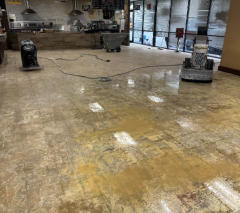 In the process of grinding glue prepping for stained concrete.