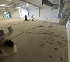 Patching and making repairs to the concrete floor. 